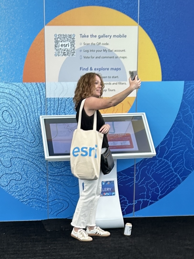 Attendee taking photo of her submitted map